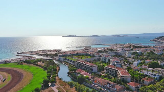Marseille, France: Aerial view of famous French city by Mediterranean Sea, famous beaches Plages du Prado, summer day with clear blue sky - landscape panorama of Europe from above
