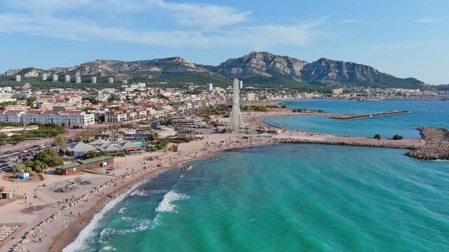 Marseille, France: Aerial view of famous French city by Mediterranean Sea, famous beaches Plages du Prado, summer day with clear blue sky - landscape panorama of Europe from above
