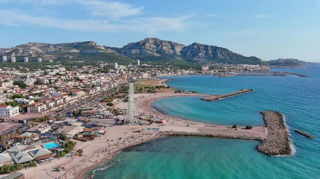 Marseille, France: Aerial view of famous French city by Mediterranean Sea, famous beaches Plages du Prado, summer day with clear blue sky - landscape panorama of Europe from above
