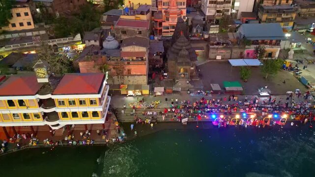 Aerial view of Godavari aarti, priest performing river godavari evening aarti at Ramkund sanatan hindu rituals Nashik Maharashtra India 4K
