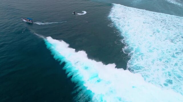 Drone top down tracking follows crashing wave and whitewash at Cloudbreak Fiji