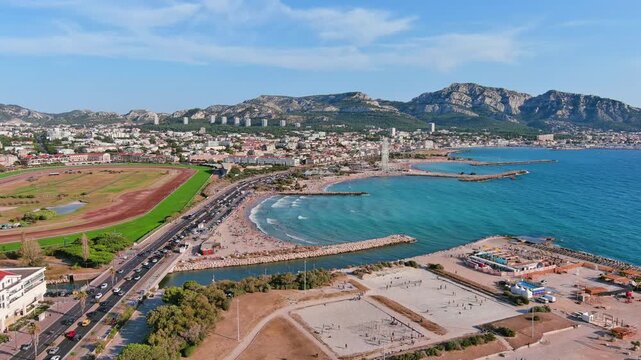 Marseille, France: Aerial view of famous French city by Mediterranean Sea, famous beaches Plages du Prado, summer day with clear blue sky - landscape panorama of Europe from above
