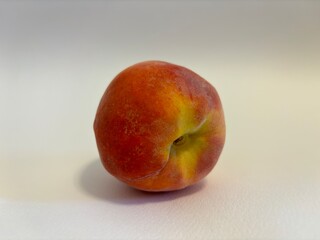 Juicy peach isolated on white background. Tasty and healthy fruit. Healthy and proper nutrition