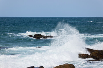 Big sea wave splash over the shore