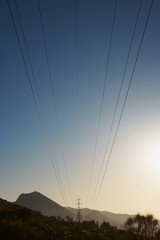 Sunset Panorama of Gran Sasso Mountains with Power Pole