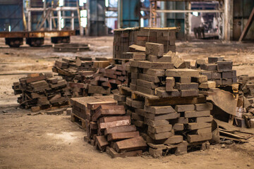 Old factory with objects abandoned inside and growing nature, power of life