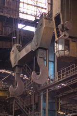 Old factory with objects abandoned inside and growing nature, power of life