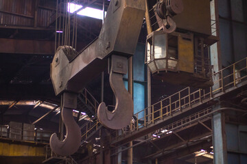 Old factory with objects abandoned inside and growing nature, power of life