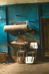 Old factory with objects abandoned inside and growing nature, power of life