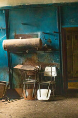 Old factory with objects abandoned inside and growing nature, power of life