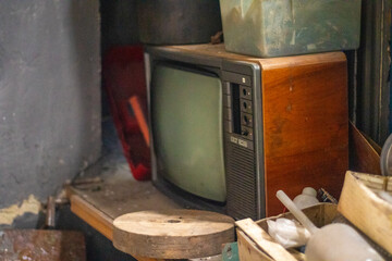 Old factory with objects abandoned inside and growing nature, power of life