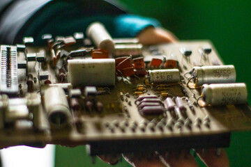 Old electronic device, Old factory with objects abandoned inside and growing nature, power of life
