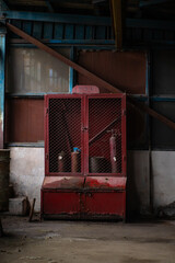 Old factory with objects abandoned inside and growing nature, power of life