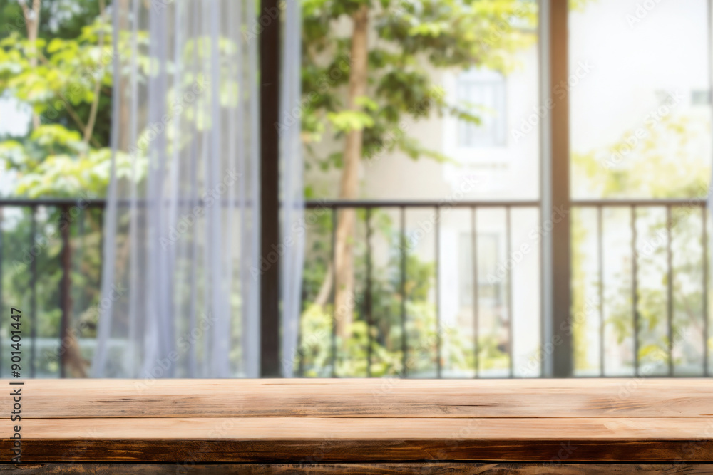 Poster empty wooden table with a blurred balcony view of a green garden background