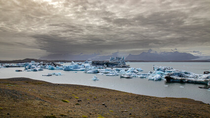 Icebergs floating on jokulsarlon glacier lagoon with storm approaching