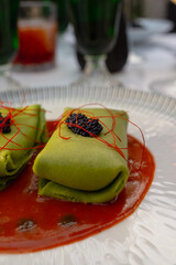 Gourmet Green Tamales: Deliciously Stuffed with Caviar and Fresh Tomato Sauce