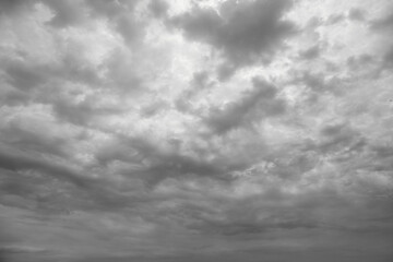 Sky with a shroud of gray clouds to the horizon closed sunlight, black and white photo of gray sky