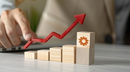 Wooden Blocks with Upward Arrow Symbolizing Business Growth and Success on a Desk