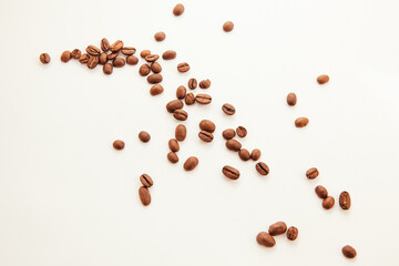 Heap of coffee beans isolated on white background, caffeine drink and food concept