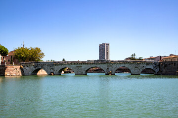 Naklejka premium Historic Tiberius Bridge, ancient Roman architecture, Rimini landmark, built 21 AD.