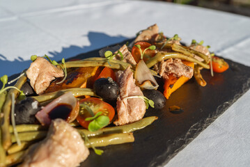 Vibrant Salad Topped with Pork Chunks Creating a City Skyline Shadow: A Unique Culinary Art Piece