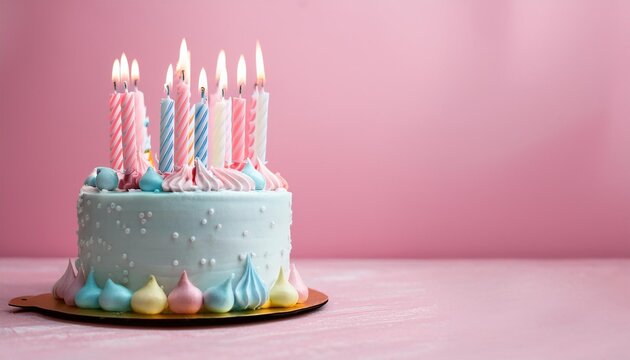 A beautifully decorated birthday cake with colorful candles and pastel decorations, perfect for celebrations and special occasions.