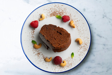 Delicious piece of chocolate cake seen from an overhead perspective.