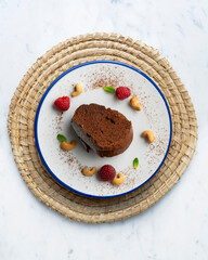 Delicious piece of chocolate cake seen from an overhead perspective.