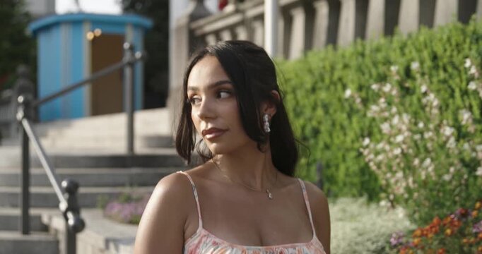 beautiful woman walks alone and looks to the side in slow motion