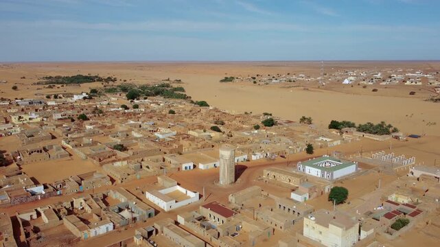 Tower in Chinguetti city, Sahara desert, Mauritania. Orbit drone shot, aerial shot
