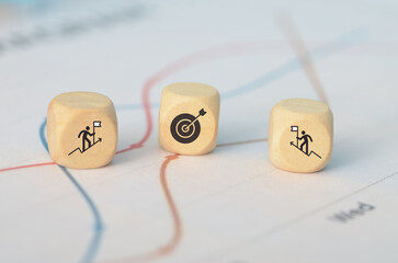 a wooden block to mark their goal target, contrasting it with the rival businessman’s position, to highlight their competitive edge.