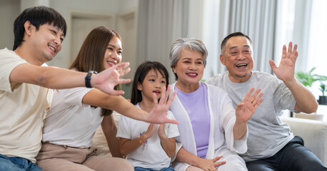 Fototapeta premium Portrait of happy love family asian father and mother playing with adorable asian kid girl.daughter, care, insurance.Happy family moments good time love with grandparents.Love of big family