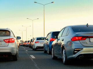 Background, bluer, blurred focus. Traffic jams on the highway during the holidays. Departure from...
