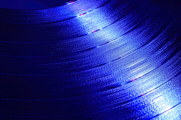 Blue Vinyl record rotating in a macro shot