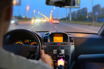 Motorway. Ring bypass road. Blurry view of the road through the windshield of the car. The car...
