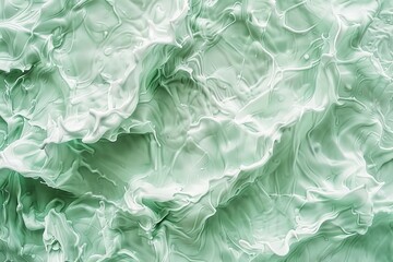 Obraz premium An abstract background of mint colored waves in sunlight with a transparent green transparent clear calm water surface texture. Copy space allows for a large image as well.