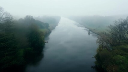 The riverbanks are muffled and muted by the heavy fog giving a sense of isolation and solitude from a low flying perspective.