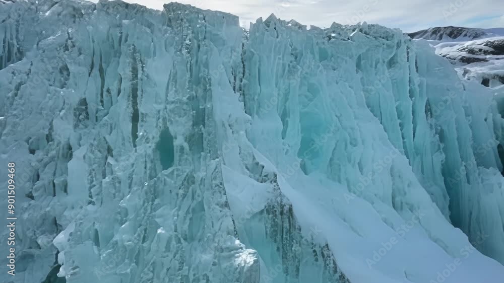 Poster a series of small waterfalls frozen over their jagged edges creating a mesmerizing pattern.