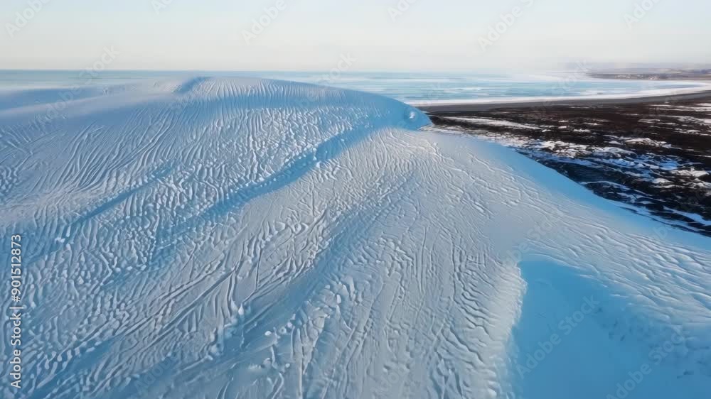 Aufkleber soft fluffy snow covering sand dunes along the coast creating a unique sight at the intersection of 
