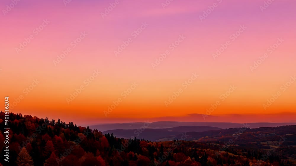 Poster A magical timelapse of the sky changing from a fiery orange to a deep blue set against the backdrop of the autumnal hills.