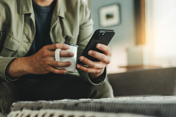using cell phone holding mobile texting message contact us.chatting,search internet shopping online.technology device communication connecting