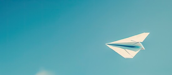 A paper airplane soaring with a clear copy space image