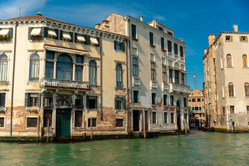 Venice, Italy - June 04, 2024: Beautiful building in Venice. Person sleep in the balcony.