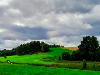 Storm is coming. Cloudy sky over Kashubian meadows.