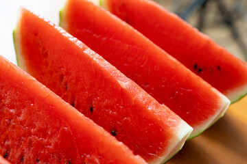 Watermelon slices closeup. Water melon wedges pile, Citrullus lanatus pieces, red wassermelone cuts...