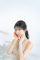 Beauty concept of middle-aged Asian woman with natural make-up. Skin care. Cosmetics. Healthy lifestyle.