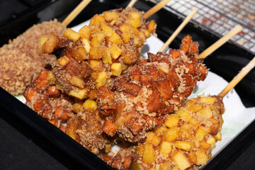 Japanese corn dog, Korean street food corndog, takoyaki, deep fried onion potato and meat