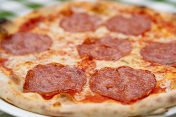 Pepperoni Pizza on Restaurant Plate, Macro Salami Pizza with Tomatoes and Mozzarella Cheese Texture, Selective Focus
