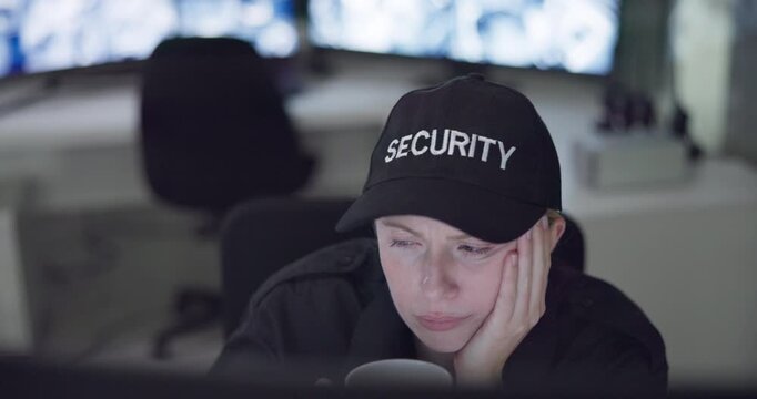 Tired woman, security and checking surveillance with coffee in control room at night for late monitoring at office. Exhausted female person or guard working late with yawn or caffeine at workplace