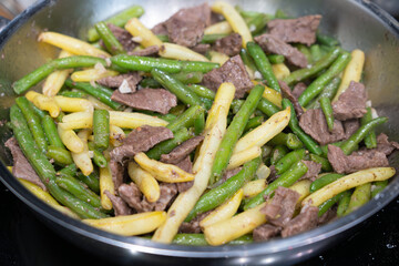Stir Frying Beef with Green Yellow String Beans Closeup, Fried French Beans Mix with Meat, Asian Food